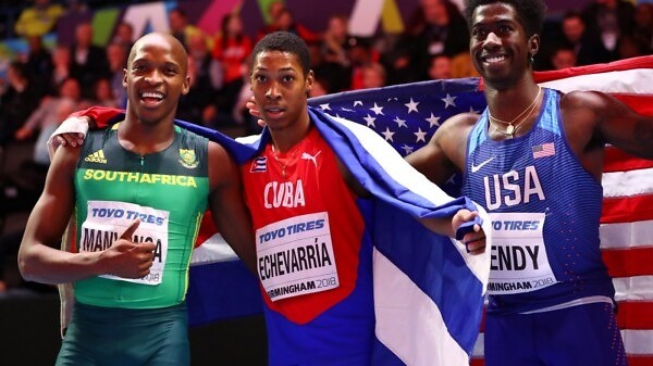 Juan Miguel Echevarria (C) of Cuba celebrates winning the Long Jump Mens Final with Luvo Manyonga (L) and Marquis Dendy (R) of United States during the IAAF World Indoor Championships on Day Two at Arena Birmingham on March 2, 2018 in Birmingham, England. credit: Photo by Michael Steele/Getty Images for IAAF