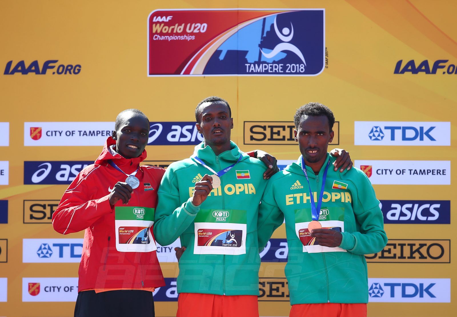 Takele Nigate (GOLD), Leonard Kipkemoi Bett (Silver), and Getnet Wale (Bronze) on the podium during the men's 3000m steeplechase medal presentation at the IAAF World U20 Championships Tampere 2018 / Photo Credit: Getty Images for IAAF