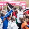 Eliud Kipchoge celebrating with his pacemakers, in Vienna at the finish line. Credit: Vienna City Marathon / Michael Gruber